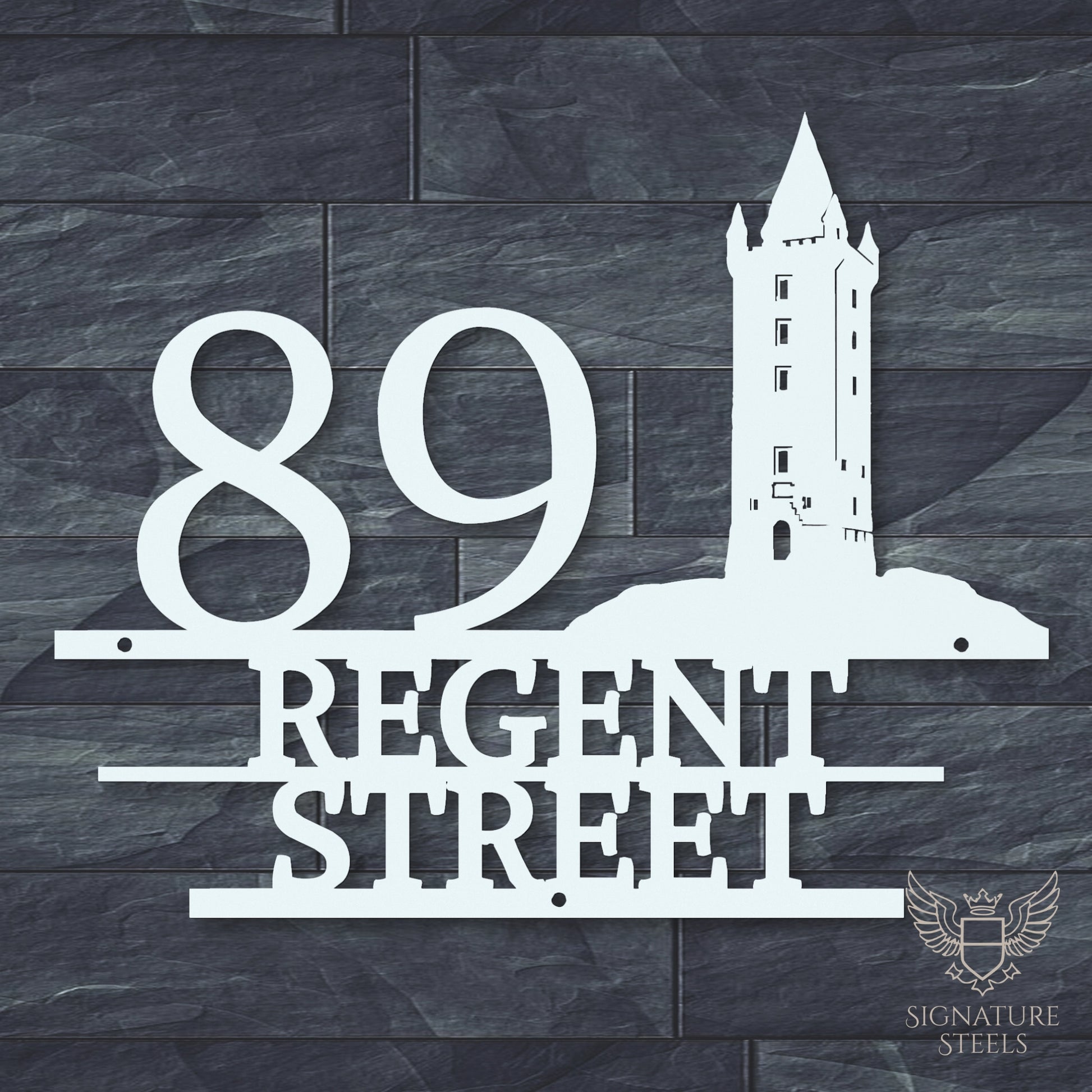 White metal address sign with house number 89, street name Regent Street, horizontal parallel lines and a silhouette of Scrabo Tower, a landmark of Newtownards in Northern Ireland, hanging on a dark grey brick wall.